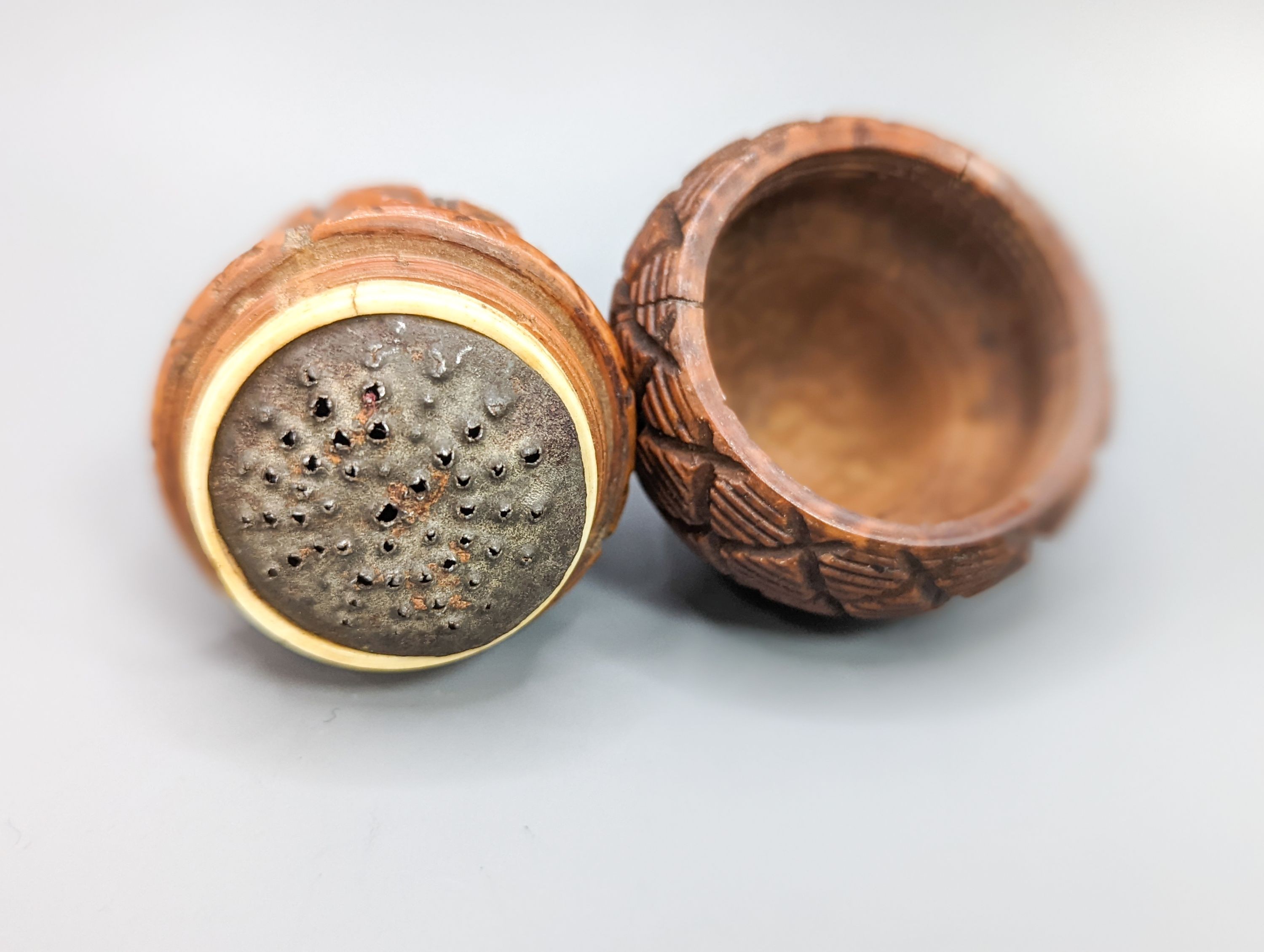 An early 19th century coquilla nut nutmeg grater, length 8cm